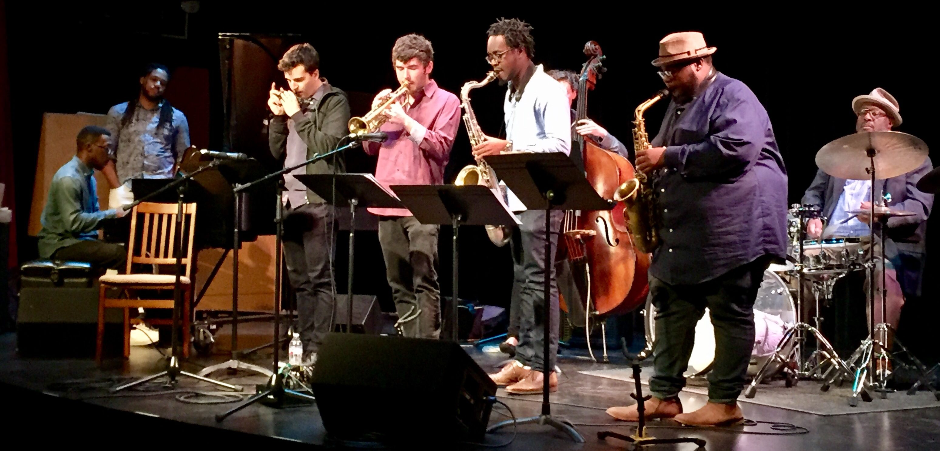 Drummer Carl Allen performs with the Thelonious Monk Institute of Jazz Performance Ensemble. Musicians onstage include a pianist, a harmonicist, a trumpeter, a tenor saxophonist, a bassist and an alto saxophonist.