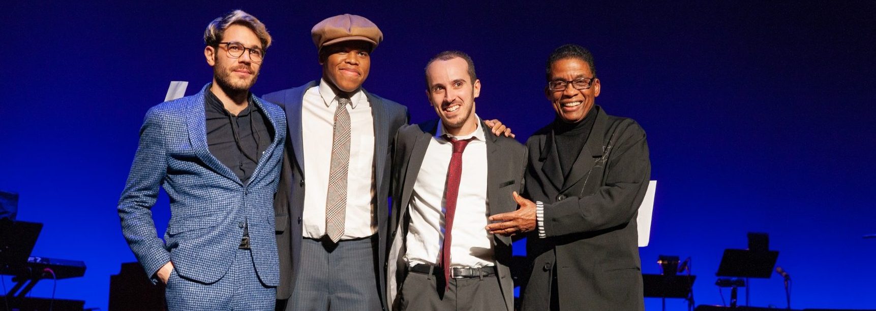 2018 Competition Finalists (from left) Maxime Sanchez, Isaiah Thompson and Tom Oren with Institute Chairman Herbie Hancock at the John F. Kennedy Center for the Performing Arts, December 3, 2018.